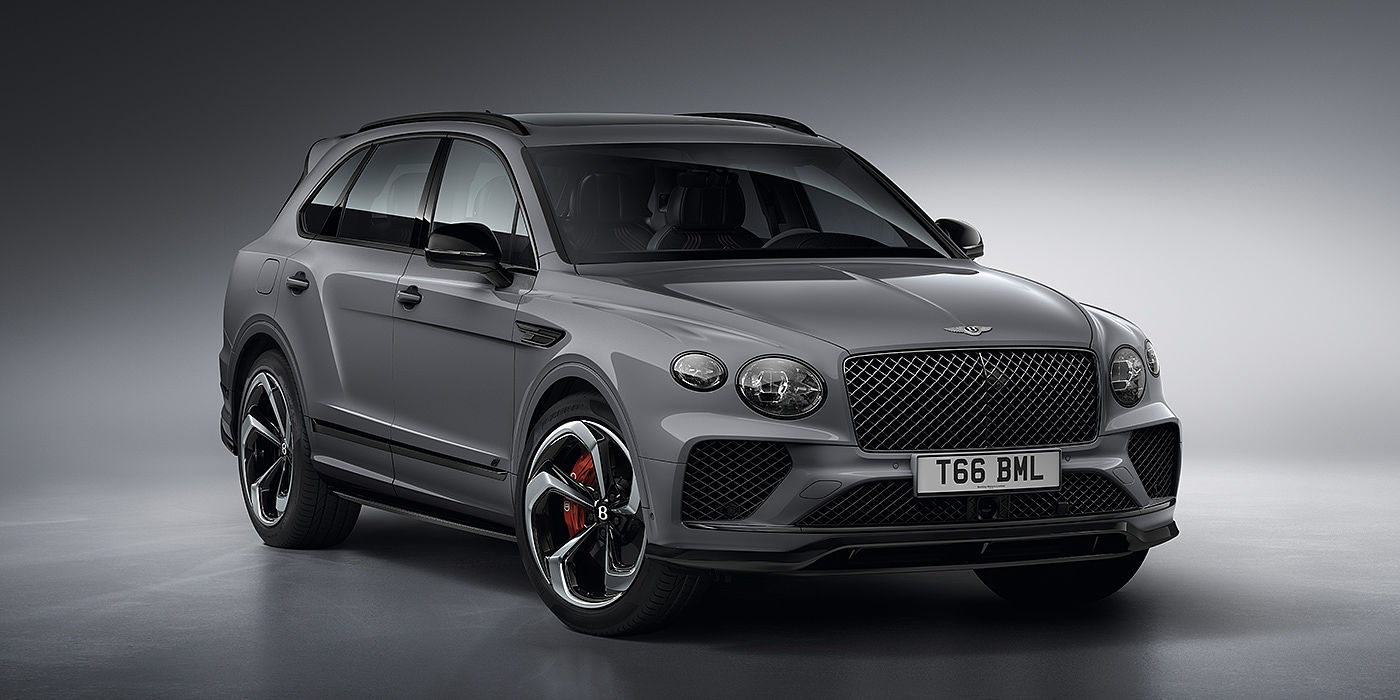 Exclusive Cars Vertriebs GmbH Bentley Bentayga S in Cambrian Grey paint front three - quarter view with dark chrome matrix grille and featuring elliptical LED matrix headlights. 