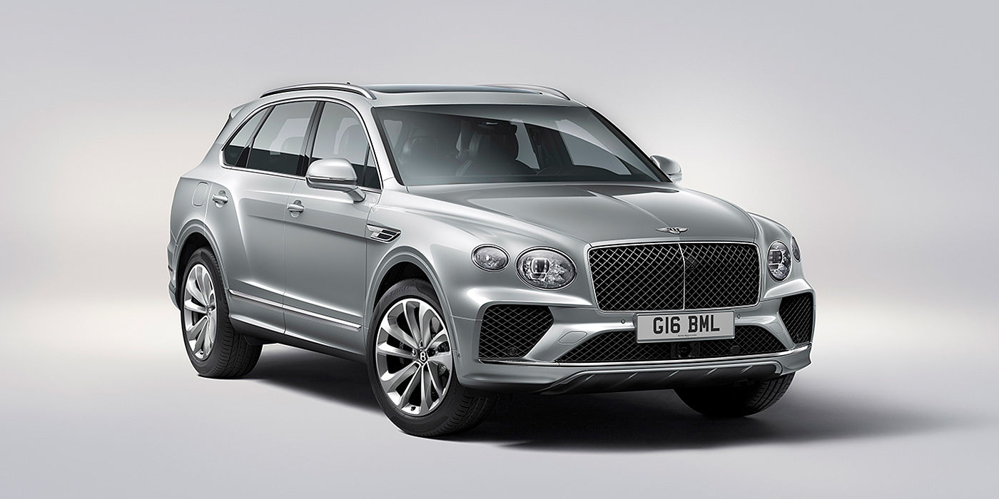 Exclusive Cars Vertriebs GmbH Bentley Bentayga in Moonbeam paint, front three-quarter view, featuring a matrix grille and elliptical LED headlights.