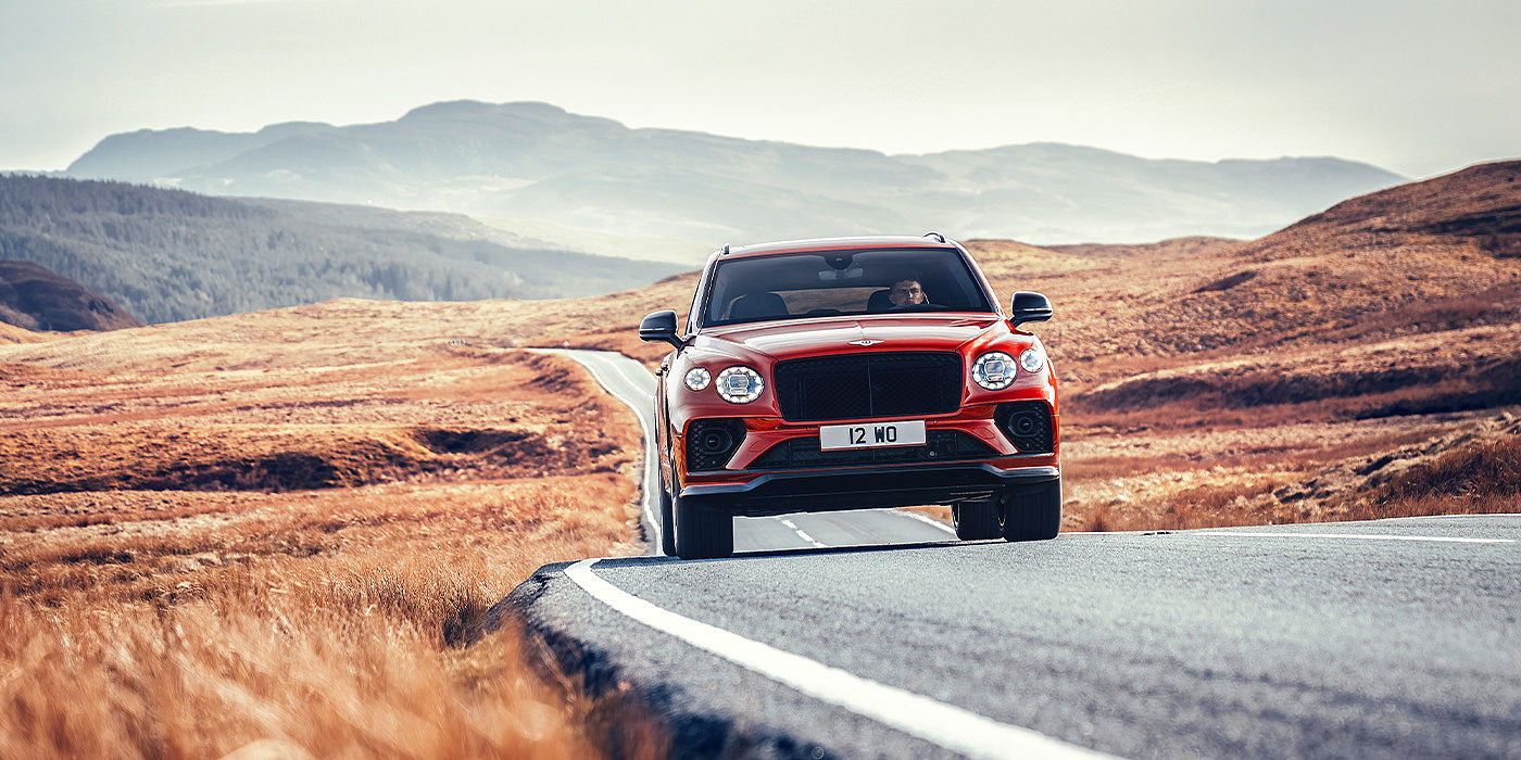 Exclusive Cars Vertriebs GmbH Bentley Bentayga S SUV in Candy Red paint full front dynamic
