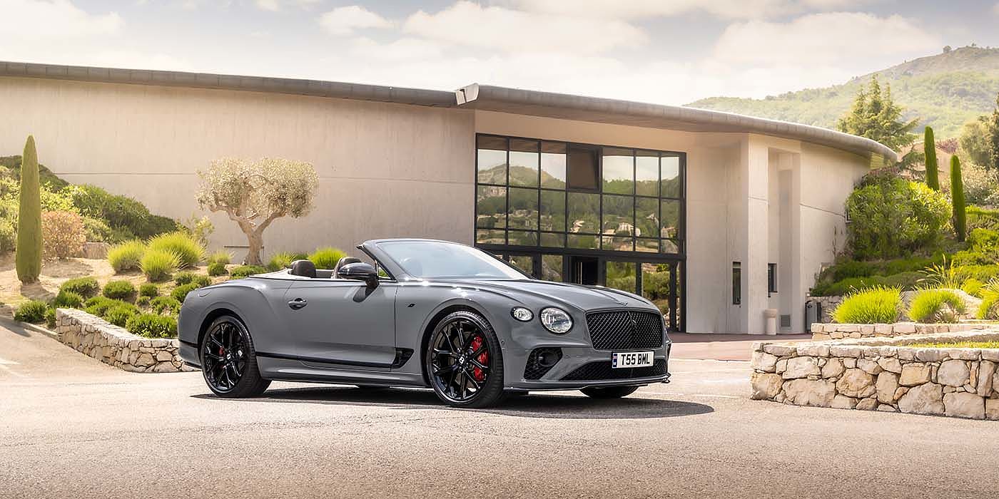 Exclusive Cars Vertriebs GmbH Bentley Continental GTC S convertible in Cambrian Grey paint front 34 static near house
