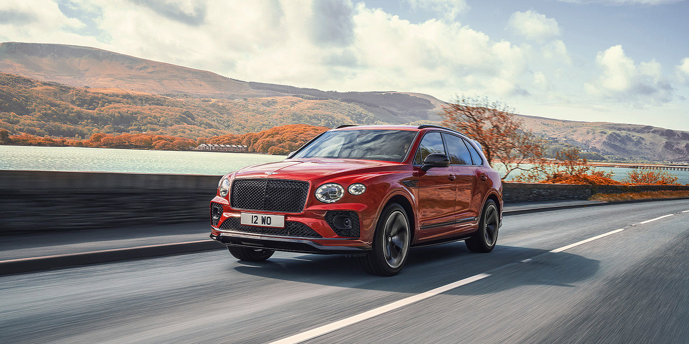 Exclusive Cars Vertriebs GmbH Bentley Bentayga S SUV in Candy Red paint front 34 dynamic