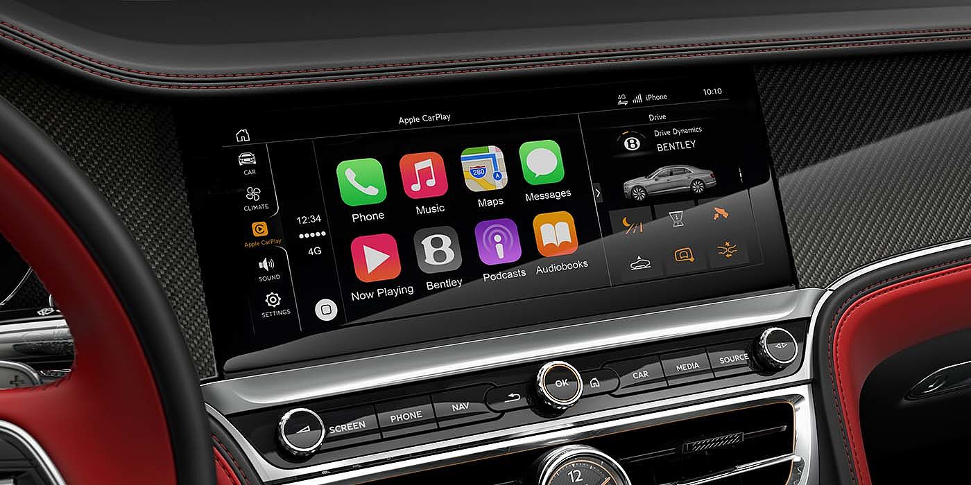 Exclusive Cars Vertriebs GmbH Bentley Flying Spur S with High Gloss Carbon Fibre veneer featuring a multifunction in car entertainment touch screen. 
