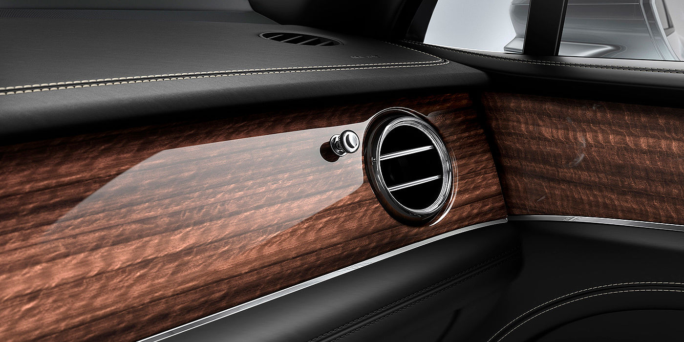 Exclusive Cars Vertriebs GmbH Bentley Bentayga front interior Crown Cut Walnut veneer and chrome air vent.