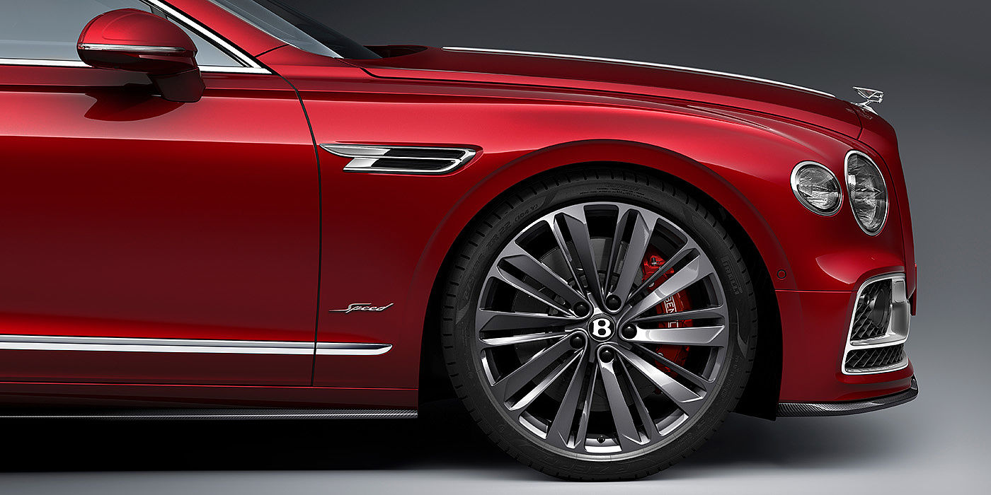 Exclusive Cars Vertriebs GmbH Bentley Flying Spur Speed sedan front wheel in close up with Dragon Red II paint