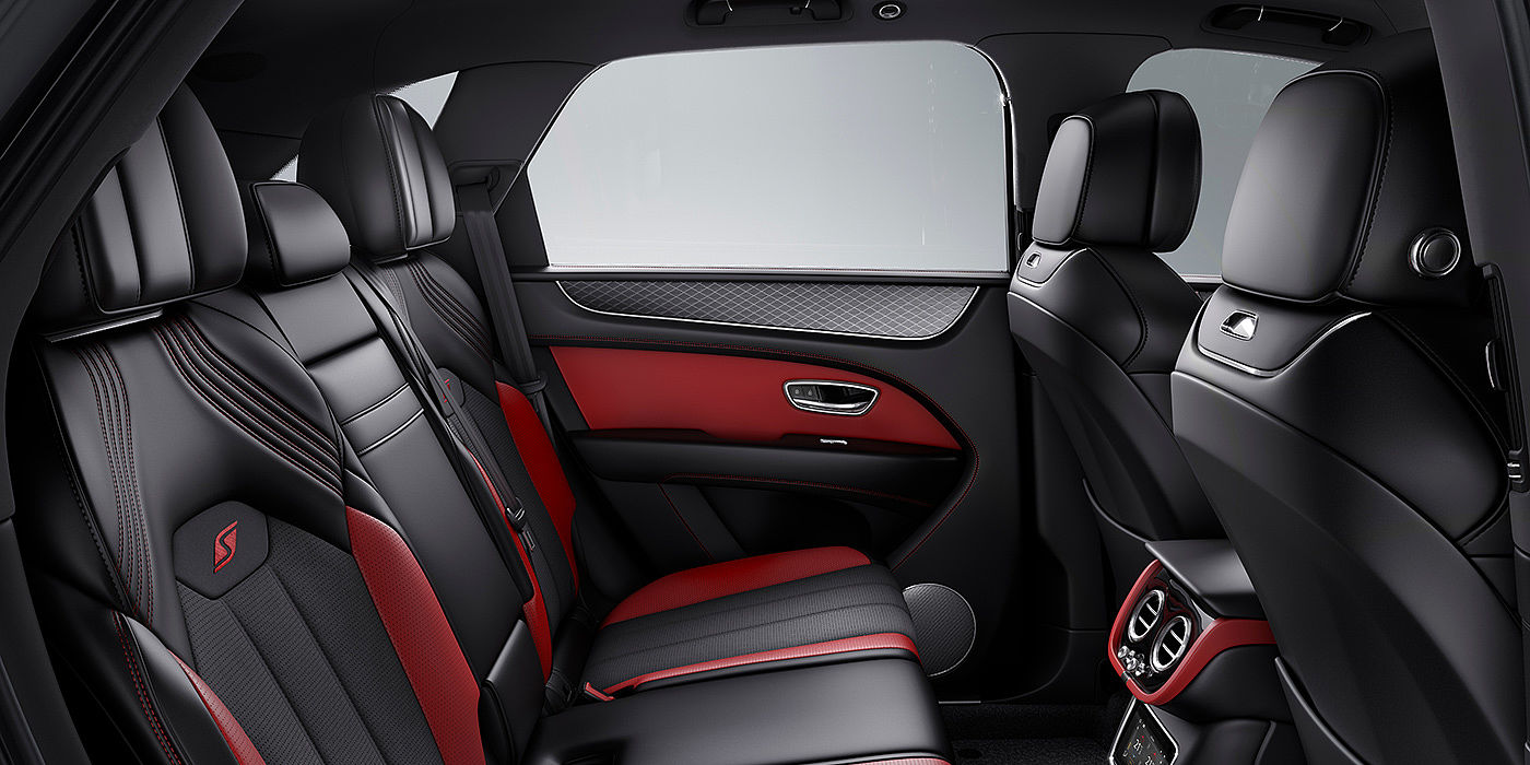Exclusive Cars Vertriebs GmbH Bentey Bentayga S interior view for rear passengers with Beluga black and Hotspur red coloured hide.