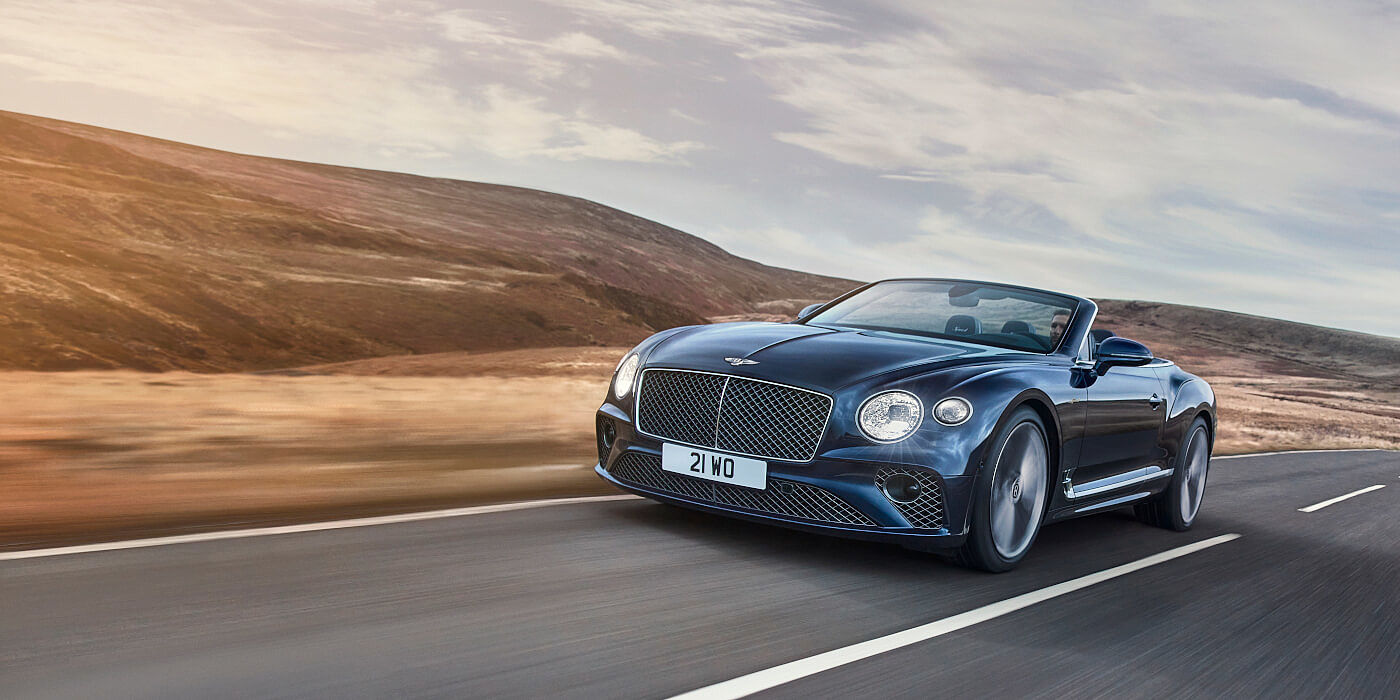 Exclusive Cars Vertriebs GmbH Bentley Continental GTC Speed convertible in Peacock paint side front 34 dynamic