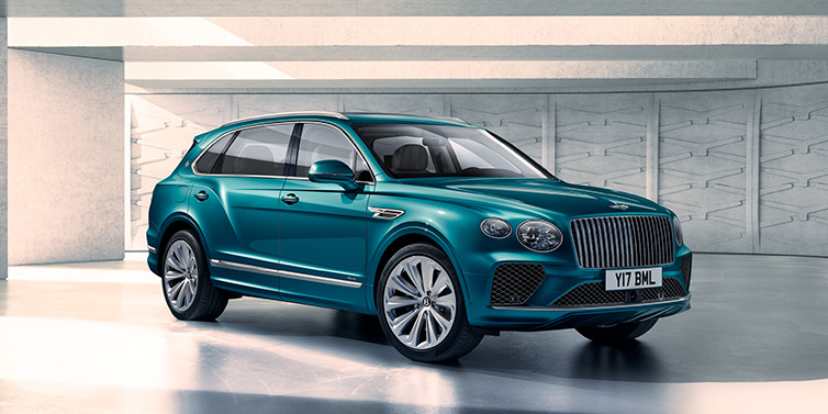 Exclusive Cars Vertriebs GmbH Bentley Bentayga Extended Wheelbase Azure SUV front three quarter in Topaz blue paint colour with a grey background