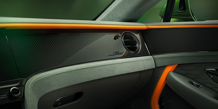 Exclusive Cars Vertriebs GmbH Bentley Continental GT Speed coupe front interior dash detail with high gloss carbon fibre veneer surrounded by Mandarin by Mulliner and Gravity Grey hides