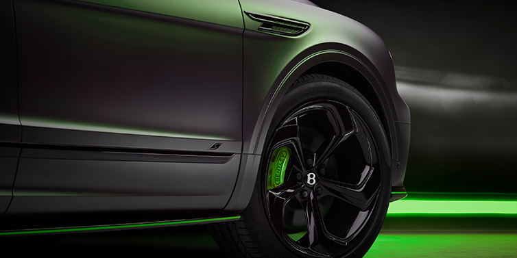 Exclusive Cars Vertriebs GmbH Bentley Bentayga S Black Edition SUV exterior wheel detail with Cyber Green brakes with Anthracite Satin paint