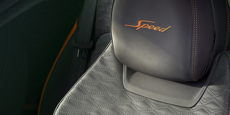 Exclusive Cars Vertriebs GmbH Bentley Continental GT Speed coupe seat detail in Gravity Grey hide and Speed emblem in Mandarin by Mulliner coloured embroidery