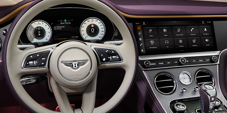 Exclusive Cars Vertriebs GmbH Bentley Continental GTC Mulliner convertible steering wheel and drivers screens surrounded by Damson purple and Linen hides